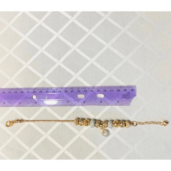 GOLD TONE CHARM BRACELET WITH 11 CHARMS 7.5 inches with a 2 inch extension chain - Picture 4 of 4